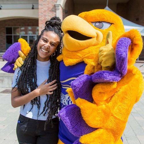 Female student with Midas mascot