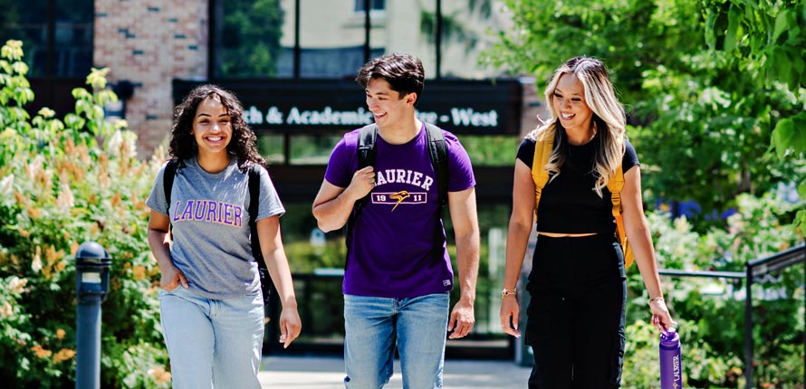 group of students walking on brantford campus in the summer