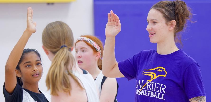 high five at girls basketball camp